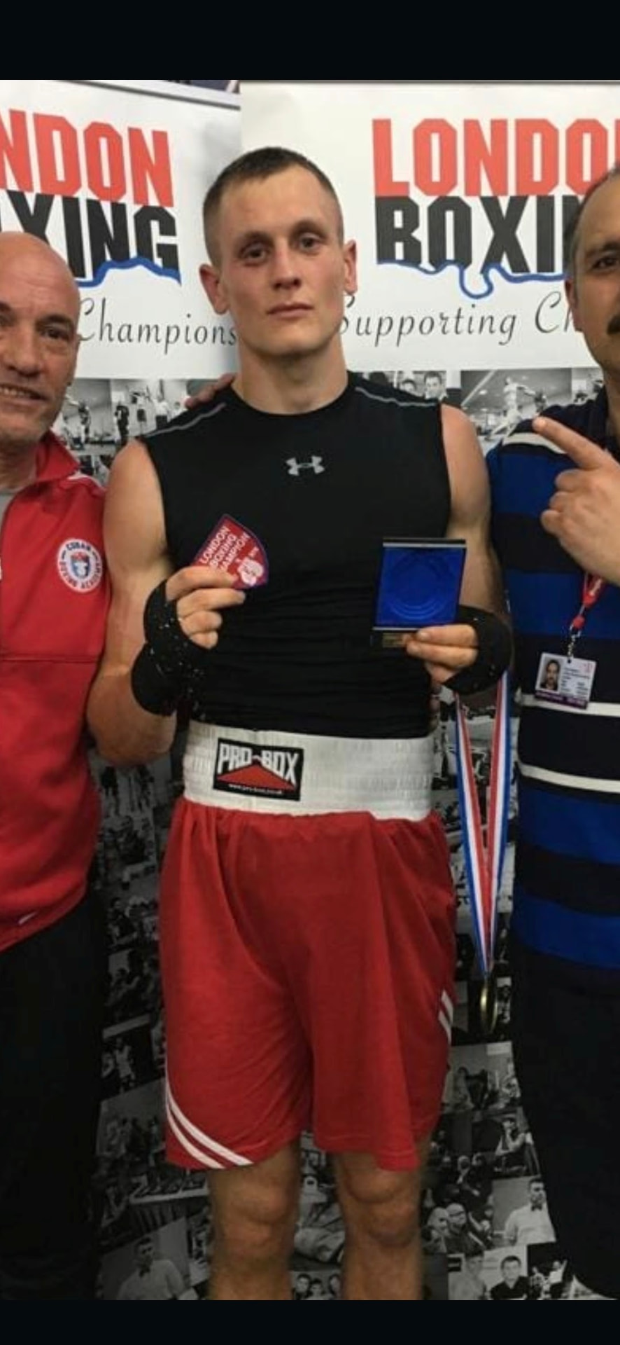 Ed with his medal and coaching team after a bout